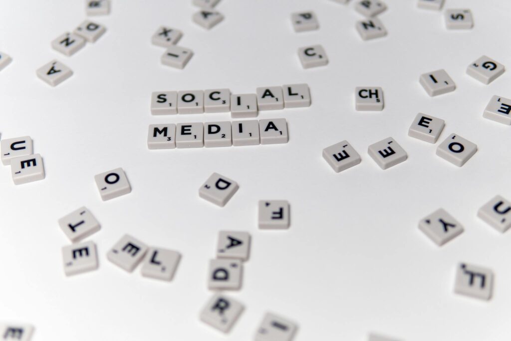 Maximizing Your Blog’s Reach: SEO Tips for Bloggers White Scrabble tiles forming the phrase 'social media' on a scattered background.