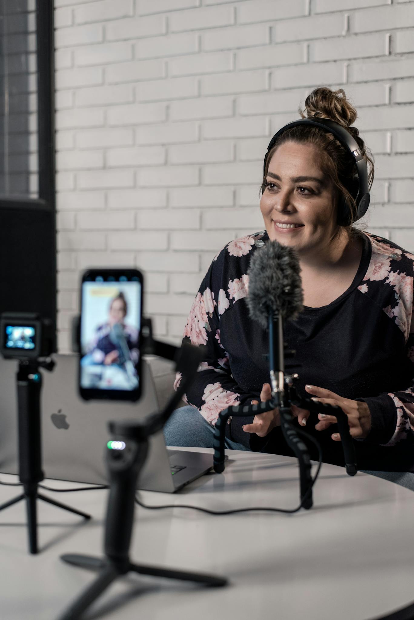 Woman Recording Video Podcast With Microphone And